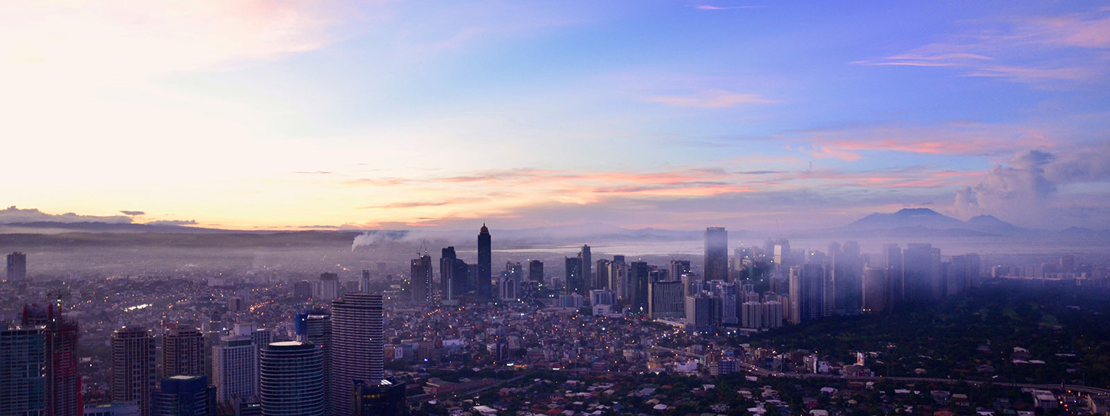 A city landscape on a foggy morning at sunrise